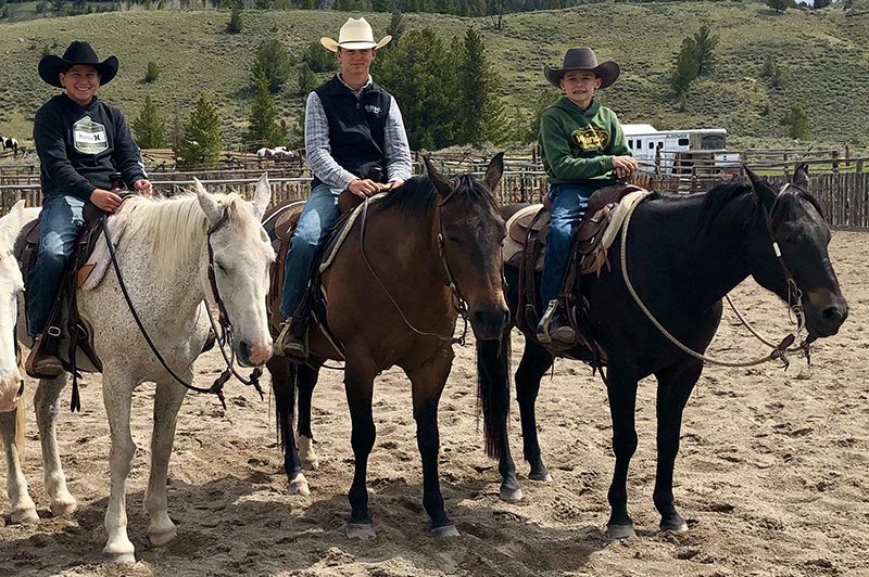 Boys on horses smiling for the camera